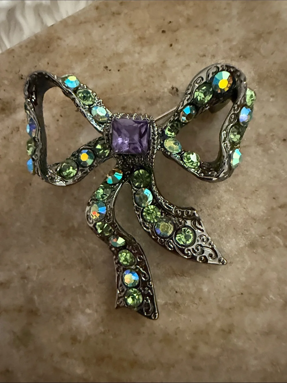 Green Crystal Bow Brooch with Purple Accent